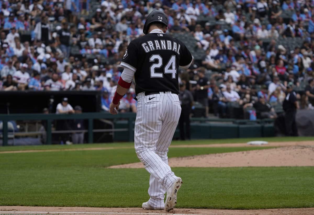 Jun 11, 2022; Chicago, Illinois, USA; Chicago White Sox catcher Yasmani Grandal (24) has to leave the game after hitting a single against the Texas Rangers during the third inning at Guaranteed Rate Field. Mandatory Credit: David Banks-USA TODAY Sports