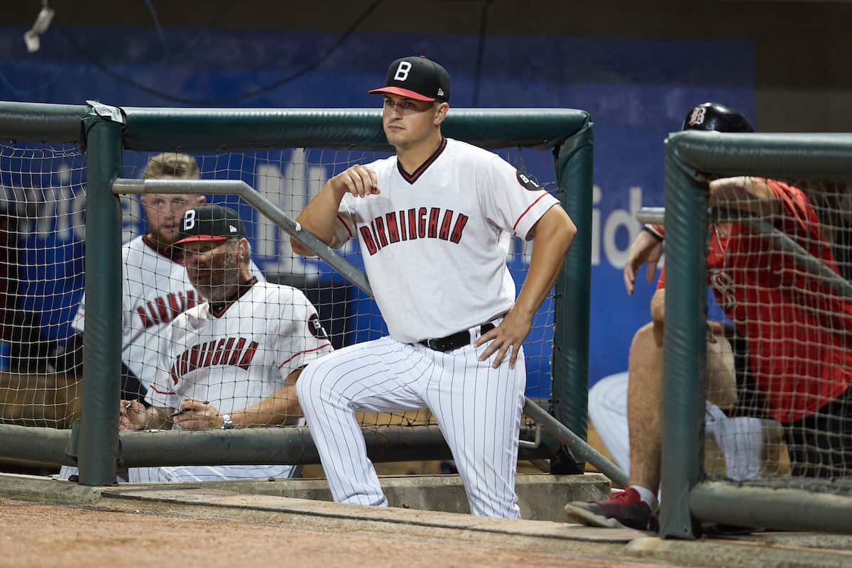 Birmingham Barons manager Justin Jirschele (9) watches from the dugout during a Southern League game against the Chattanooga Lookouts at Regions Field on August 5, 2022, in Birmingham, Alabama. (Brian Westerholt/Four Seam Images)