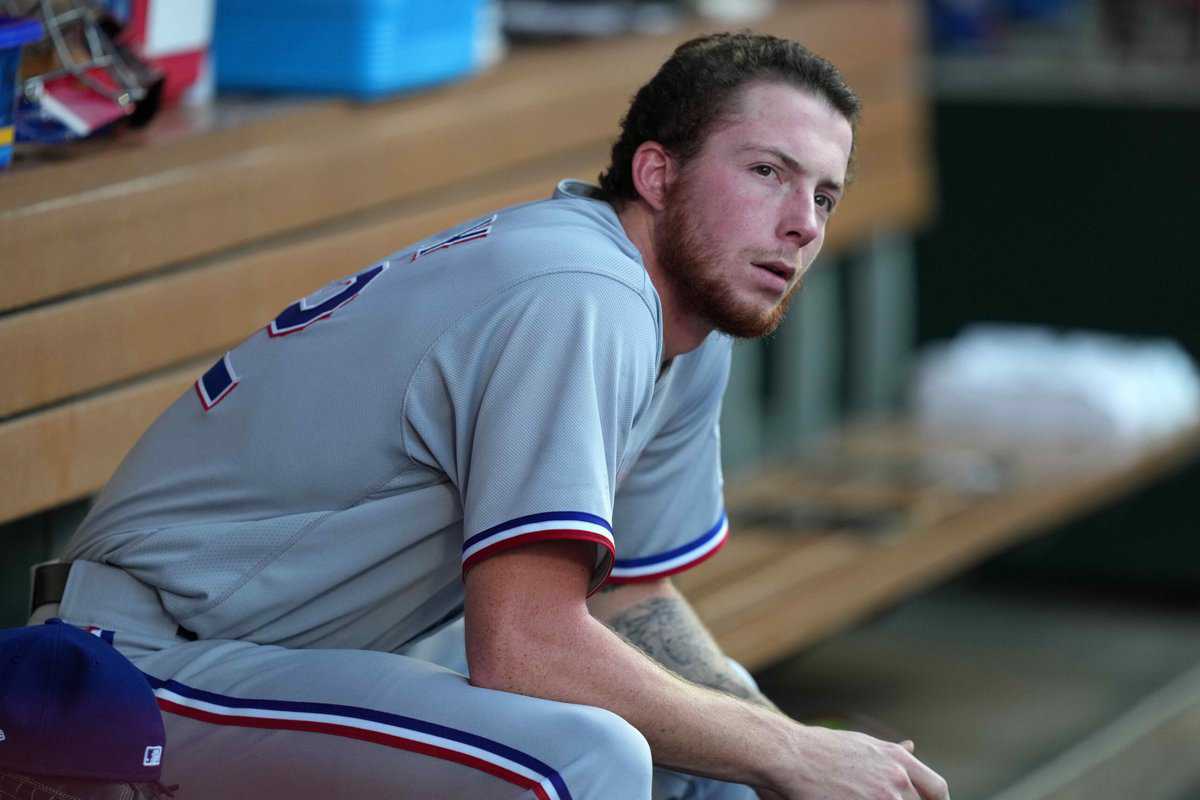 Sep 6, 2021; Anaheim, California, USA; Texas Rangers starting pitcher A.J. Alexy (62) watches from the dugout in the second inning against the Los Angeles Angels at Angel Stadium. Mandatory Credit: Kirby Lee-USA TODAY Sports