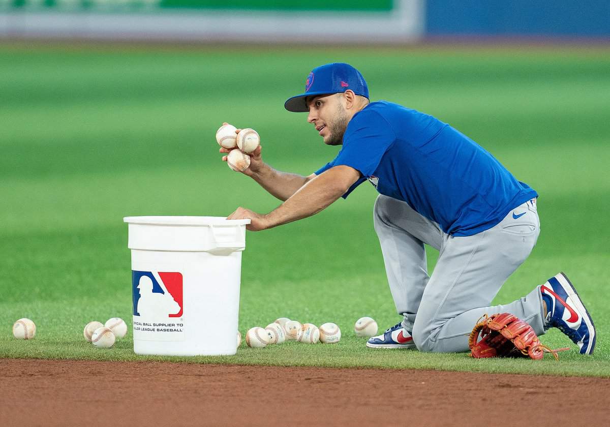 Aug 31, 2022; Toronto, Ontario, CAN; Chicago Cubs second baseman Nick Madrigal (1) picks up balls during batting practice against the Toronto Blue Jays at Rogers Centre. Mandatory Credit: Nick Turchiaro-USA TODAY Sports