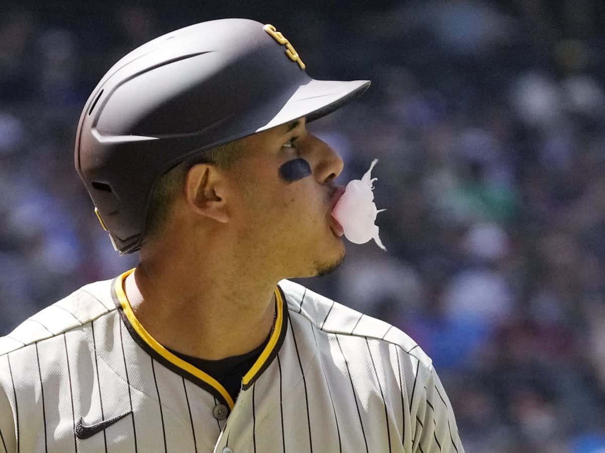 San Diego Padres third baseman Manny Machado (13) blows a bubble after striking out against the Arizona Diamondbacks during the second inning at Chase Field on April 10, 2022.