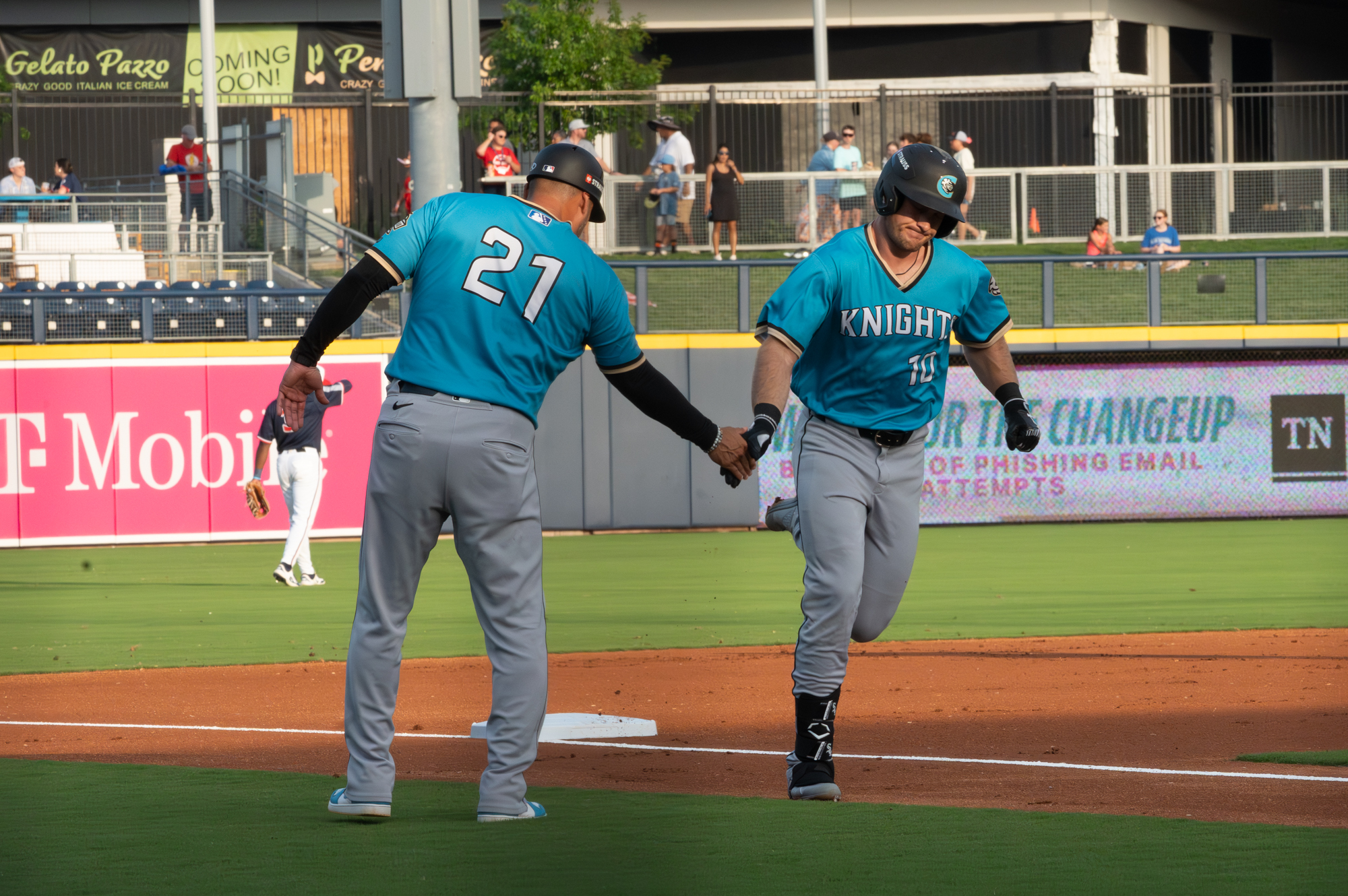 Will Robertson celebrates a home run with Sergio Santos
